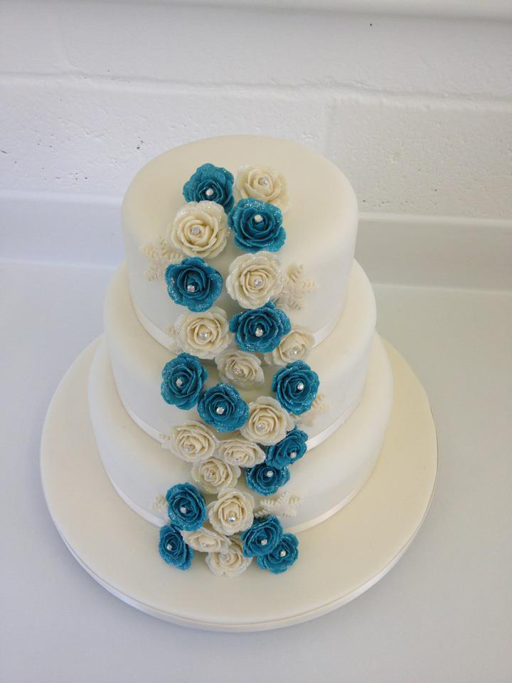 Three Tier Classic Wedding Cake, Cascading Ivory and Blue Roses