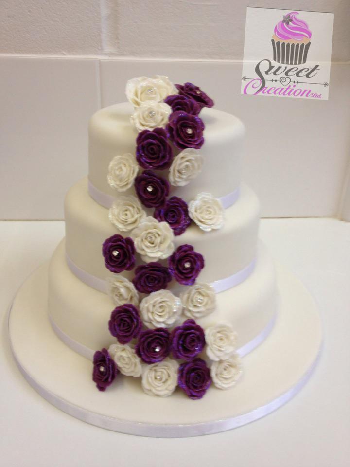 Three Tier Classic Round White Wedding Cake, with cascading roses